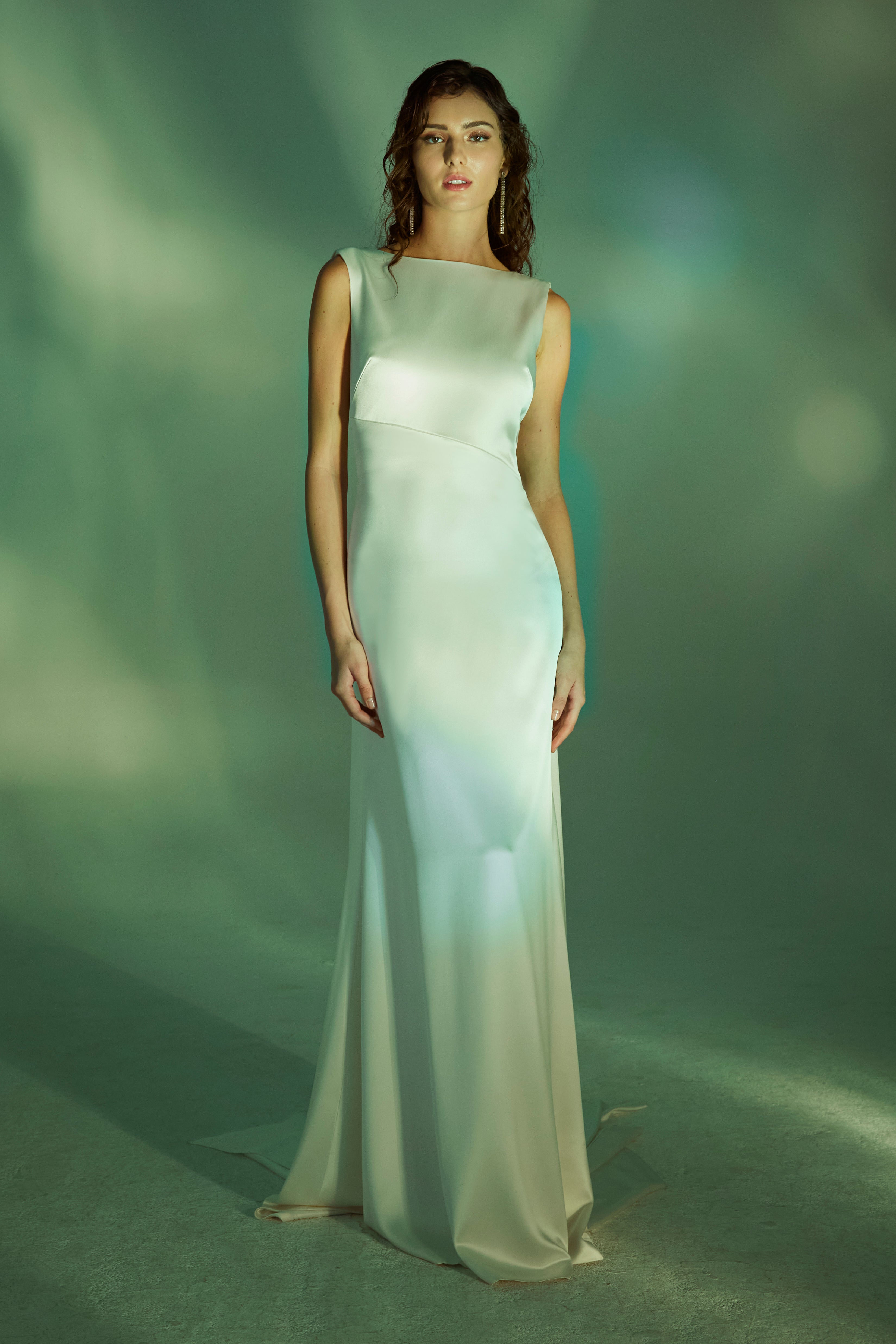 Bias cut high sheen satin siren gown with bateau neck and plunging asymmetric draped back