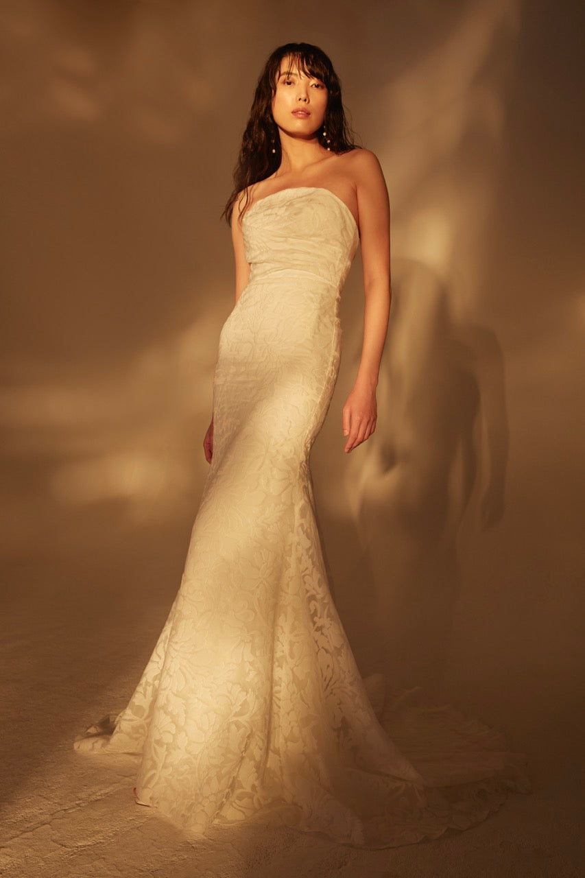 Fil coupe draped strapless siren gown and arched neckline