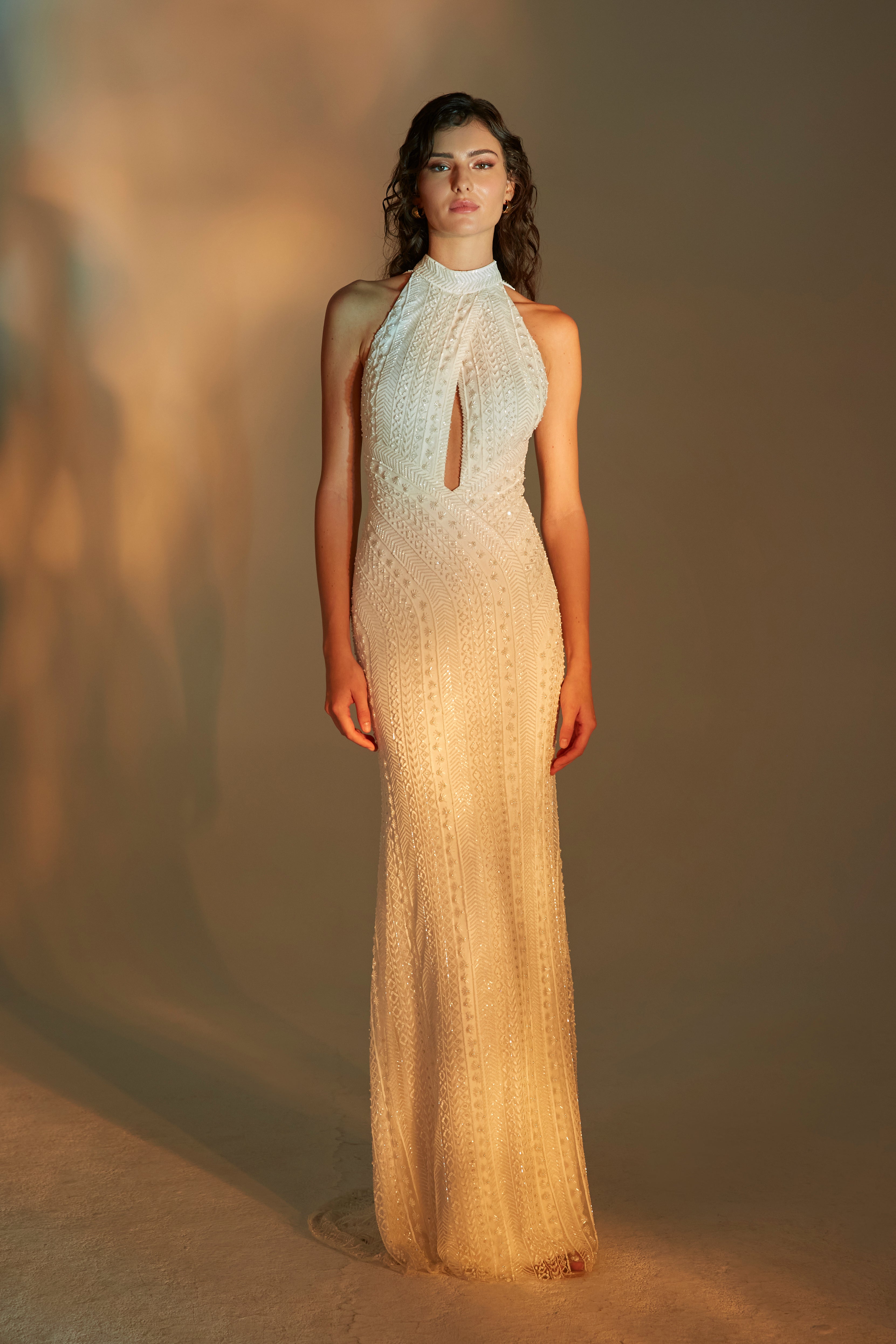 Halter neck siren gown with keyhole, open back detail and Stratus contoured beading